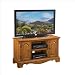 Home Styles Country Casual Wood TV Stand in Distressed Oak Finish