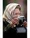 Photographic Print of Queen Elizabeth II uses a Leica camera from PA Photos