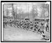 Historic Print (L): [Igorot men from the Philippines wearing loincloths and carrying hand drums, dance in a