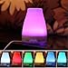 Essential Oil Diffuser, 100ml Portable Aroma Cool Mist Air Humidifier with Adjustable Mist Mode 7 Color Changing LED Lights, Waterless Auto off for Home Office Spa (LM-008)