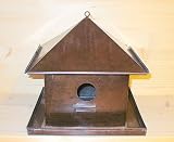 Vogelhaus aus Metall eckig kupfer