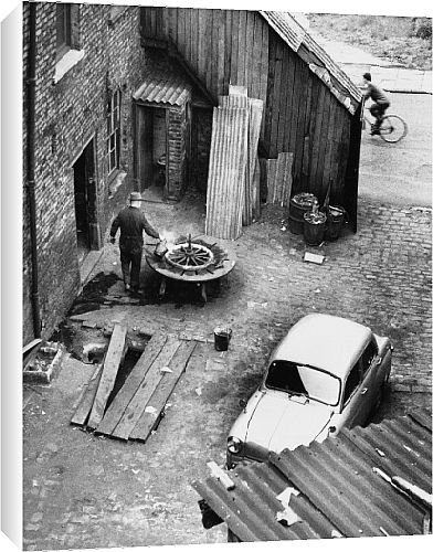 Canvas Prints of Wheelwright in garage yard - Manchester from Mary Evans