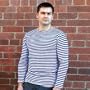 RUSSIAN NAVY STRIPED SHIRT LONG SLEEVED TELNYASHKA (XL) [Made in Moscow, Russia. Size: XL. Material: Cotton. Long sleeves] ["A telnyashka is a knitted sailor's undershirt with dark blue and white stripes" -- these are just a few lines in a dictionary, but contained within them is an entire life: the life and history of a garment known and loved by all. A telnyashka, as this type of sailor's garment is known, appeared during the era of sailing fleets. In the second half of the 19th century, white and blue stripes were added to the shirt for practical reasons: sailors working on masts in this shirt were highly visible on decks against the background of the sky, sea, and sails. Apart from that, the telnyashka, in comparison with other uniforms, was very practical: it was warm, snugly fit the body, didn't interfere with free movement during any activity, was easy to wash, and almost never wrinkled. Its colors were also those of the Andreivsky flag, and reminded all of the sea and ships. And not by chance, its informal name, truly a national and beloved element of sea equipment, sounded proud and significant: the soul of the sea! The word "telnyashka" comes from the Russian word "telo," which means "body." Indeed, this shirt lives up to its affectionate name, which describes how it fits the body like a glove, keeping it warm in the stormiest of seas]