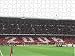 Jigsaw of Arsenal fans in the North Bank hold up cards that read 2006 from Arsenal FC