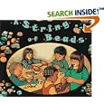 A String of Beads by Margarette S. Reid and Ashley Wolff