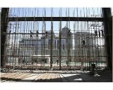 10x8 Photograph (25x20cm) Construction workers build a curtain wall at the CYTS by Arcaid