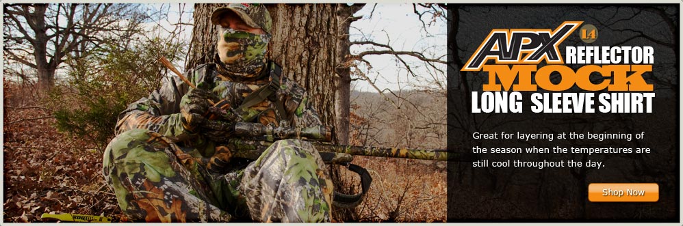 Hunter Stalking by Tree Wearing Russell Outdoors APX l4 Mock Shirt