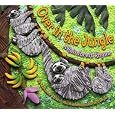 Over In The Jungle: A Rainforest Rhyme (Turtleback School & Library Binding Edition)