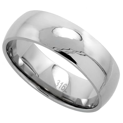 Wedding rings on thumbs