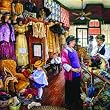 Buying Hats 1000pc Jigsaw Puzzle by Susan Brabeau