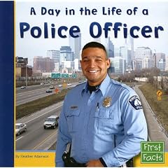 A Day in the Life of a Police Officer (First Facts: Community Helpers at Work)
