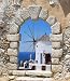 Windmill through an Old Venetian Window, Greece - 24