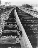 Railroad track scene,showing close-up of a rail joint
