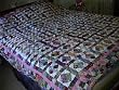 Scrappy 4 patch diamond bed quilt