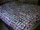 Scrappy 4 patch diamond bed quilt