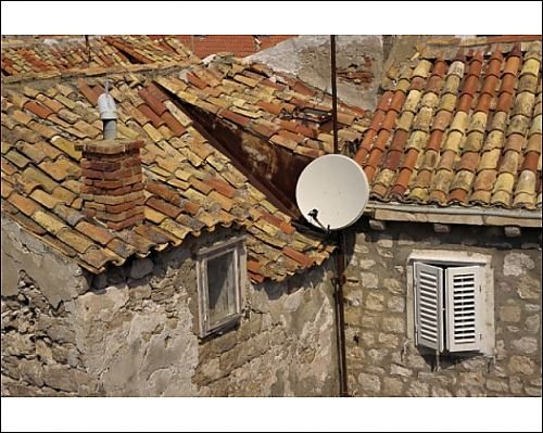 Photographic Prints of Close-up of roof tiles, old stone walls and satellite dish in the old town of from Robert Harding