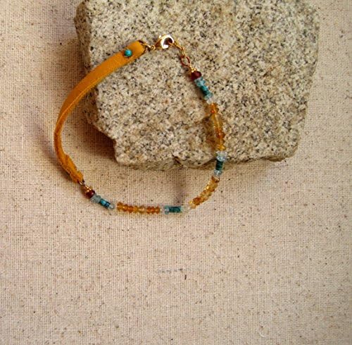 Beautiful bracelet blend of gemstones and leather suede lace. Native American style pattern of aqua-marine, citrine, turquoise, garnet and rainbow moonstone.