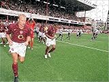 Jigsaw of Dennis Bergkamp and Thierry Henry (Arsenal) run out at the start of the match from Arsenal FC