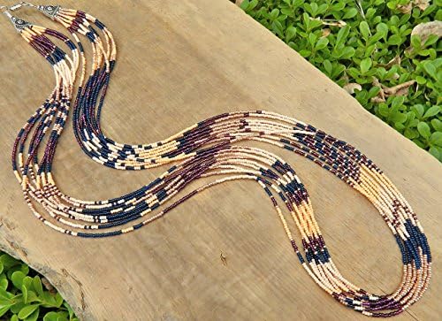 Rich color Southwest style long seed bead patterned statement necklace. Gold, dark blue, purple, peach, beige
