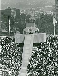Entertainment Memorabilia: Vintage photo of An athlete lights the cauldron in the stadium to start the Olympic games.