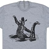 L - Bigfoot Riding On Nessie T Shirt Loch Ness Monster Funny Shirt Sasquatch Shirtmandude Shirts