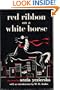 Red ribbon on a white horse