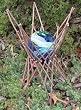 Blue Glow in the Dark Glass Gazing Globe in a Natural Twig Stand