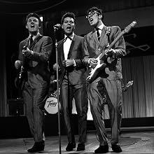 The Shadows - London, England. 1960. Singer Cliff Richard (centre) is pictured perfoming with "The Shadows", including Brian Locking (left) and Hank Marvin, on ATV's "Sunday Night at the Palladium".