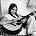 Nicolette Larson - Singer Nicolette Larson w a guitar