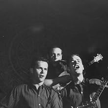 The Kingston Trio - The Kingston Trio performing on stage.