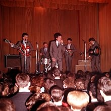 The Hollies - 1964. Manchester pop band "The Hollies" in live action before an enthusiastic audience made up of their fans.