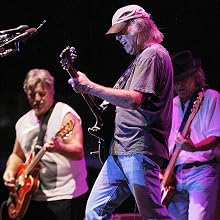 Crazy Horse - Canadian rocker Neil Young (C) jams with