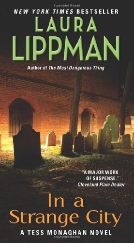 In a Strange City: A Tess Monaghan Novel by Laura Lippman