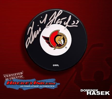 

Dominik Hasek Autographed Hockey Puck - Ottowa Senators - Autographed NHL Pucks