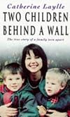 Two Children Behind A Wall